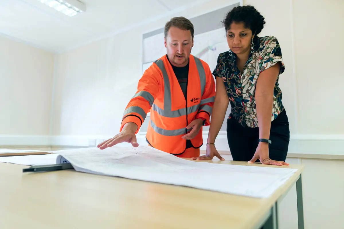 Engineers reviewing project drawings
