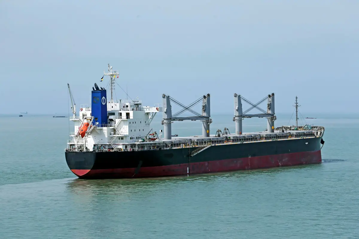 Container ship loaded with shipping containers at sea