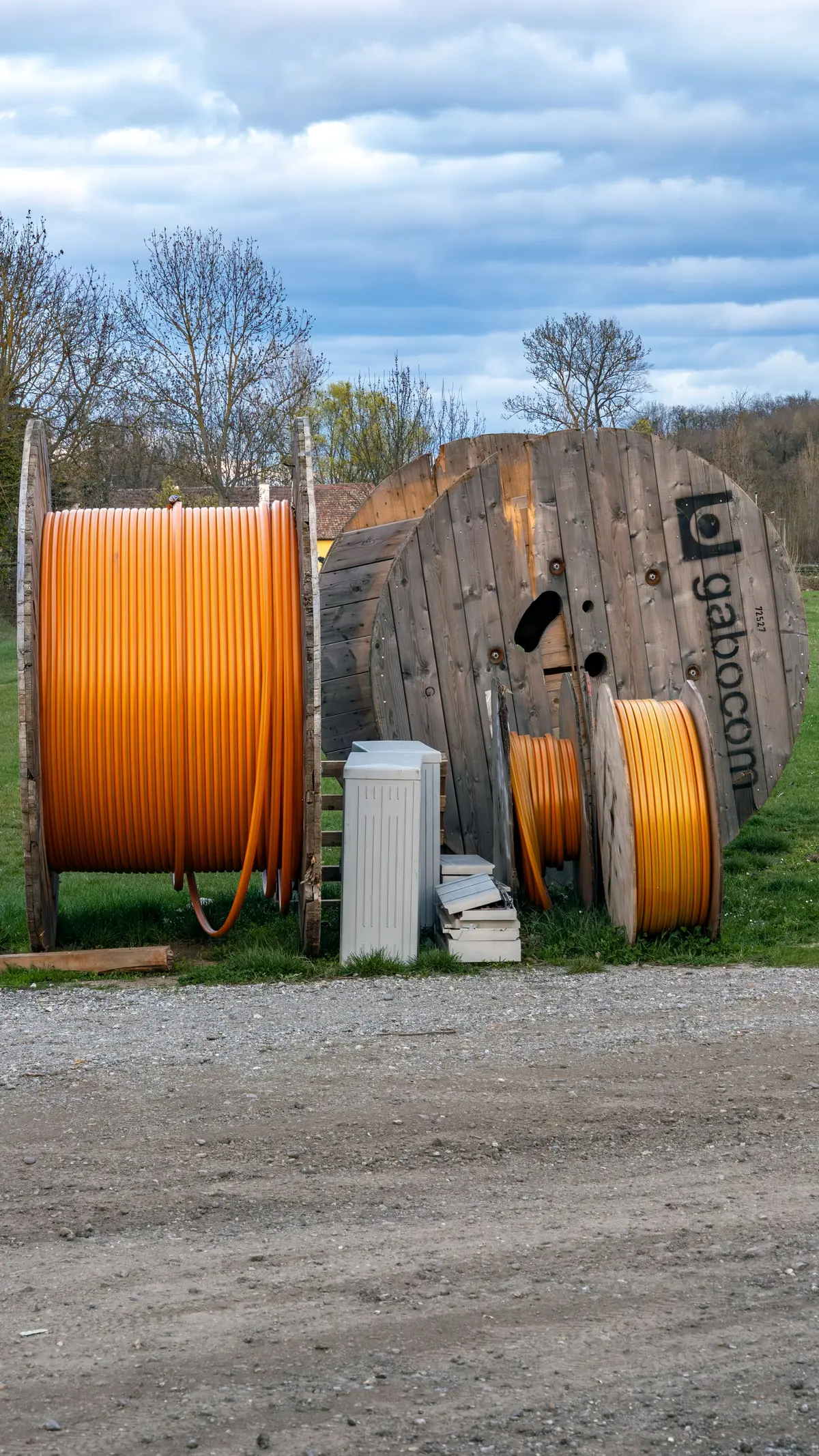 Cable reels staged at an industrial yard